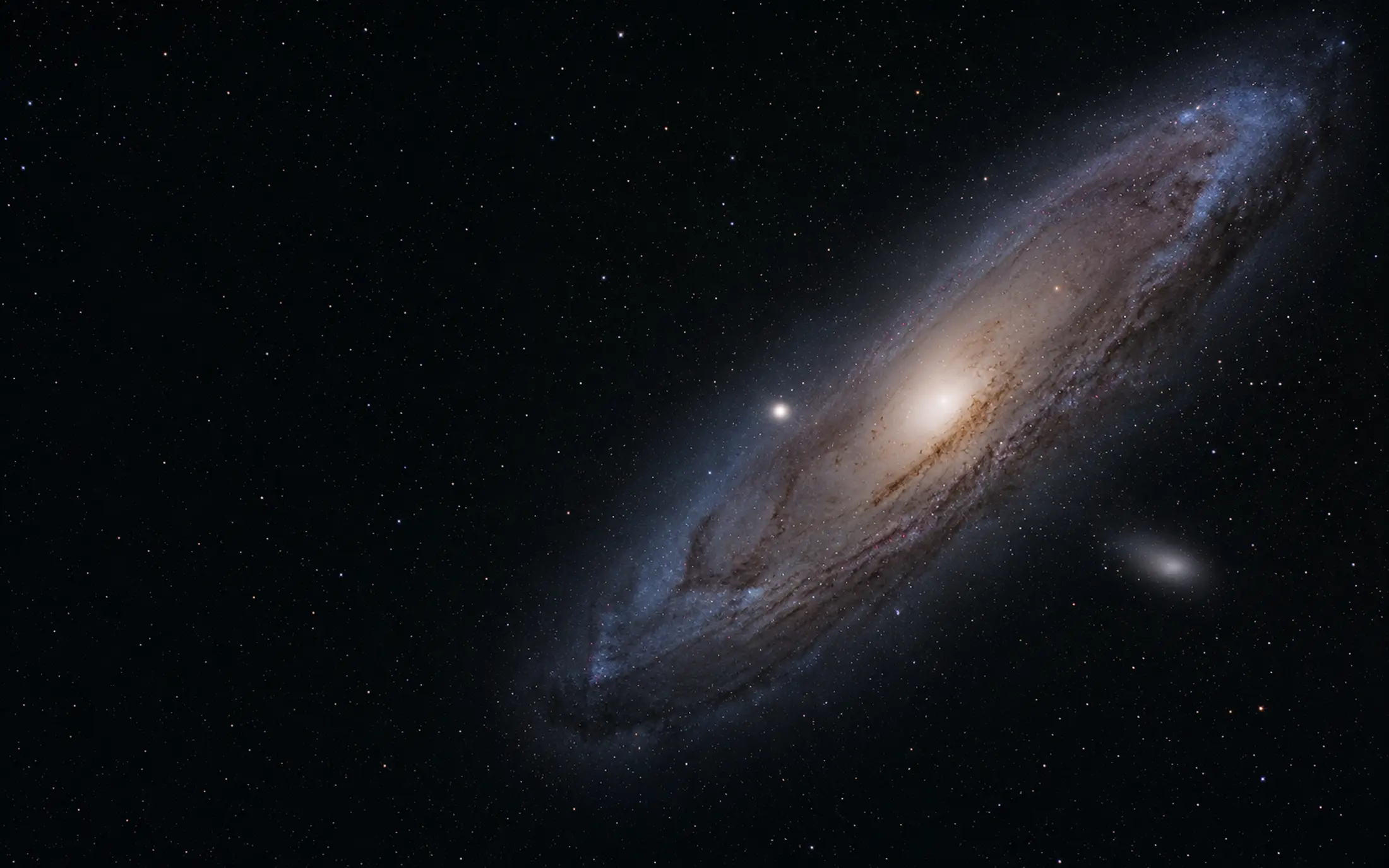 The Andromeda Galaxy, with a bright ivory core and blue outer arms